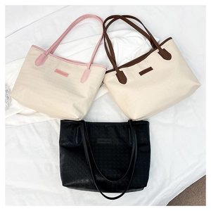 Chic high-capacity tote bags with contrast straps and embossed texture for daily commute