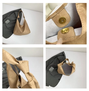 Détails du sac hobo en daim marron avec poignée nouée et fermoir magnétique doré