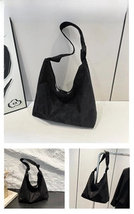 Détail d'un sac cabas en daim noir avec design de nœud décoratif sur la bandoulière