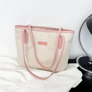 Large cream and pink tote bag with embossed houndstooth pattern for daily commute