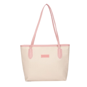 Fashionable beige and pink oversized tote bag with patterned texture and leather handles