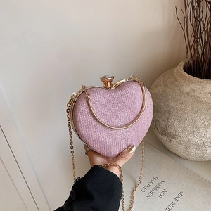 Pink heart-shaped glitter evening clutch bag with gold chain and crystal clasp