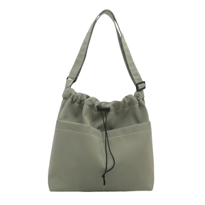 Large olive green nylon tote bag with drawstring closure and front pockets for commuting