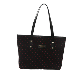 Sac fourre-tout noir à motifs de cœurs rouges avec des détails en métal doré chic