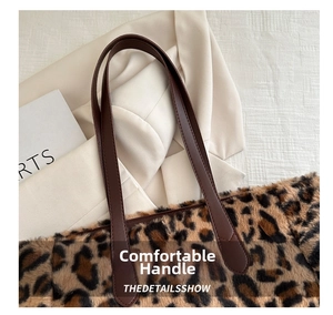 Detail of leopard print faux fur tote bag with brown leather handles and soft texture