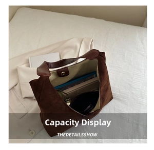 Detail showing the large interior capacity of this dark brown frosted leather tote bag