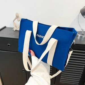 Contrast navy blue canvas tote bag with white handles and fashion print for daily commute
