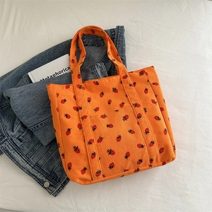 Orange corduroy tote bag with strawberry print and large capacity for daily use