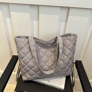 Modern silver-grey quilted puffer tote bag with large capacity for daily commuting