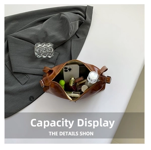 Top view of brown leather bag showing large capacity for phone and cosmetics