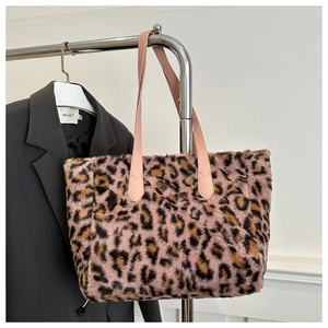 Close-up of pink leopard print faux fur tote bag with premium leather handles
