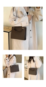 Detail view of brown vintage geometric pattern tote bag with gold chain strap