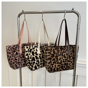 Three plush leopard print tote bags in purple, beige and brown with leather straps