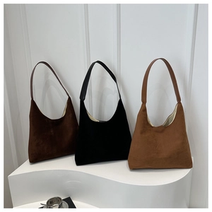 Minimalist matte hobo shoulder bags in brown, black and tan colors with suede texture
