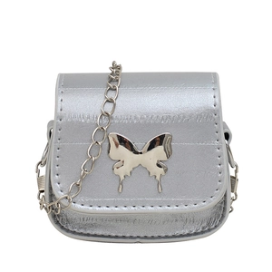 Mini silver crossbody chain bag with metallic butterfly detail and stone texture finish