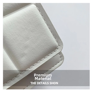 Close-up of white crossbody bag showing premium leather texture and diamond stitch detail