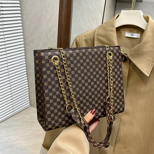 Brown vintage geometric canvas tote bag with gold chain strap for minimalist styling