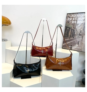 Chic retro crossbody bags in black, red, and tan leather with silver star emblems