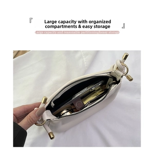 Interior view showing the large capacity of a white vintage faux leather shoulder bag