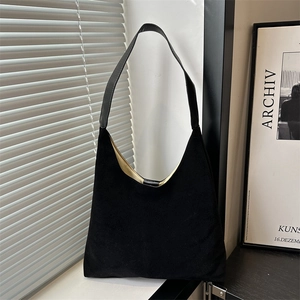 Minimalist black suede tote bag with yellow lining and fixed leather shoulder straps