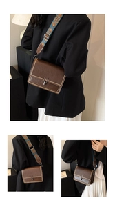 Dettagli della borsa vintage marrone con borchie metalliche e tracolla larga etnica