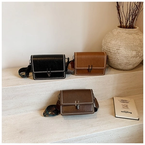 Detail of vintage square crossbody bags in three colors with stylish patterned wide straps