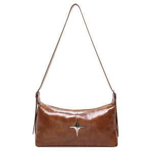 Retro brown leather moon bag with silver star hardware and adjustable shoulder strap