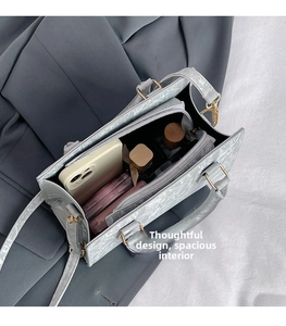 Interior view of marble pattern PU bag showing spacious capacity and gold hardware