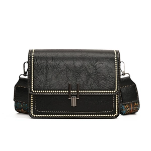 Retro black crossbody bag with pleated texture and wide colorful ethnic style shoulder strap
