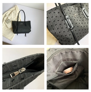 Detail of polka dot tote bag with metal bow logo, top zipper, and inner zip pocket