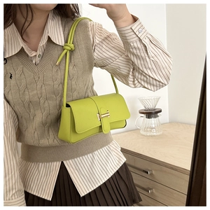 French style baguette shoulder bag in lime green leather shown in a lifestyle mirror selfie