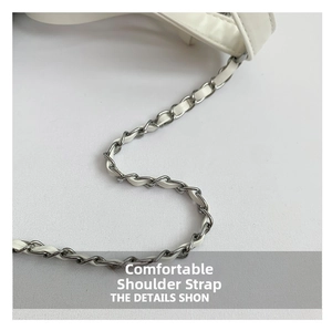Close-up of the woven metal chain and white leather strap detailing on the shoulder bag