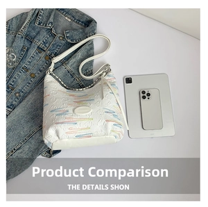 Size comparison of white embroidered tote bag next to tablet and smartphone