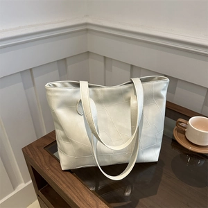 Fashionable cream tote bag with geometric stitching for women, stylish commuter shoulder bag