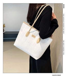 Close-up of white tote bag with beige straps and JINGPIN logo for daily commuting