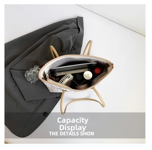 Top view of white textured tote bag showing spacious interior with tablet and daily essentials