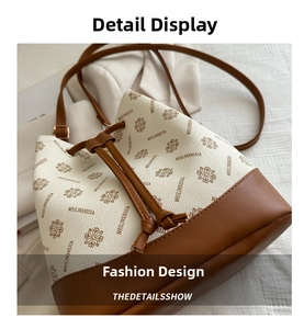 Detail of retro bucket bag with cream litchi texture and brown drawstring closure