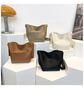 Litchi pattern leather bucket bags in caramel, taupe, off-white and black colors