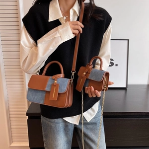 Fashionable caramel leather and blue denim patchwork crossbody bag with mini charm bag