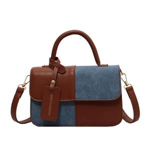 Autumn vintage brown leather and blue denim patchwork shoulder bag with top handle
