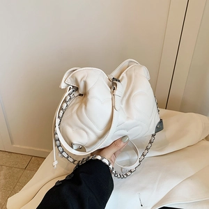 White heart-quilted large tote bag with silver chain strap and metal corner detail