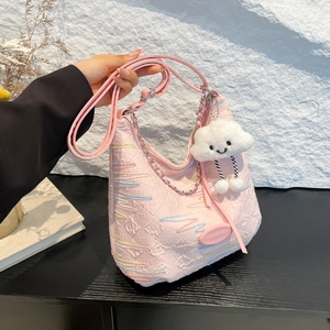 Pink pleated canvas bucket bag with striped embroidery, metal chain and plush charm