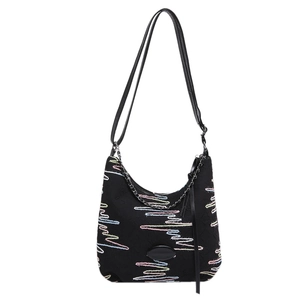 Black canvas crescent hobo bag with colorful wave embroidery and silver chain