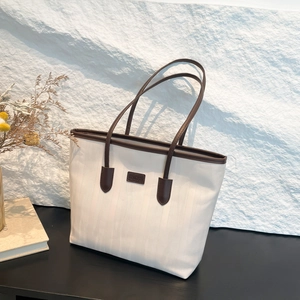 Large capacity canvas tote bag in cream and brown for commuting and college students