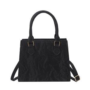 Chic black pleated PU crossbody bag with trapezoid structure and golden hardware details