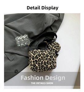 Detail view of leopard print crossbody bag with detachable round coin purse and strap