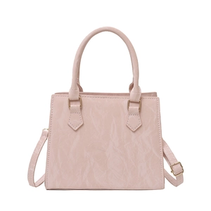 Pink pleated PU leather handbag with golden hardware and adjustable shoulder strap