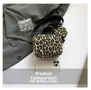 Size comparison of leopard print crossbody bag with a smartphone and mini pouch