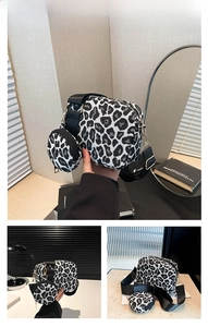 Detail view of leopard print shoulder bag set with adjustable strap and coin purse