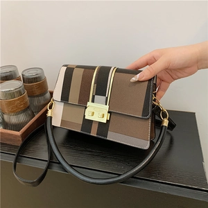 Fashionable color-block crossbody bag with geometric stripes and metal buckle closure